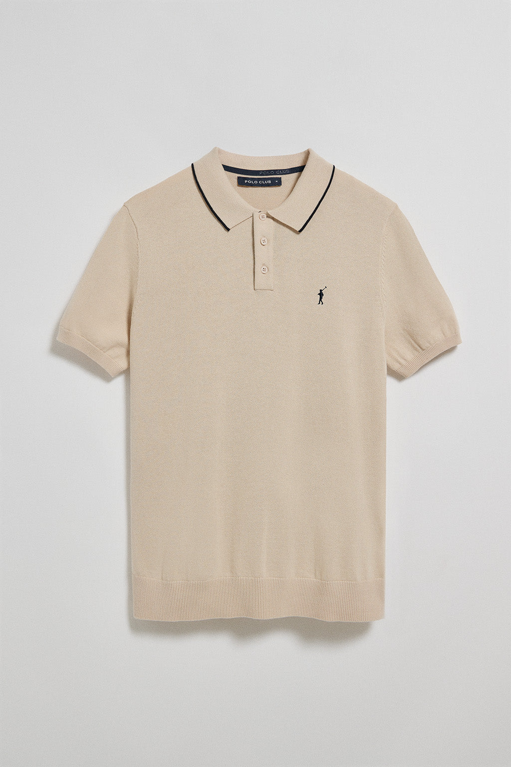 Polo beige de punto con botones