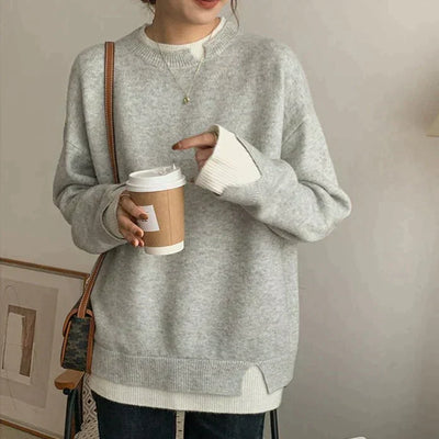 Grau-weißer pullover